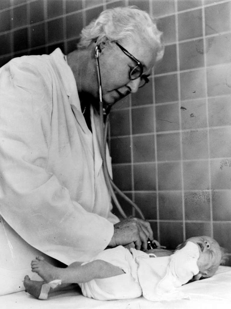 Black and white photo of Virginia Apgar and a baby