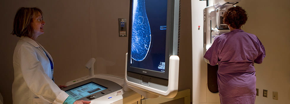 Legacy doctor performing breast cancer screening on patient