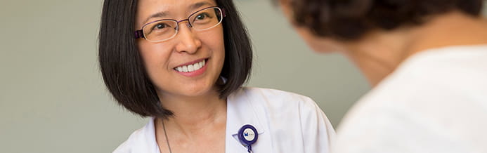 Portland-based cervical cancer specialist speaking with a patient