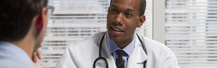 Cancer specialist discussing lung cancer treatments with patient