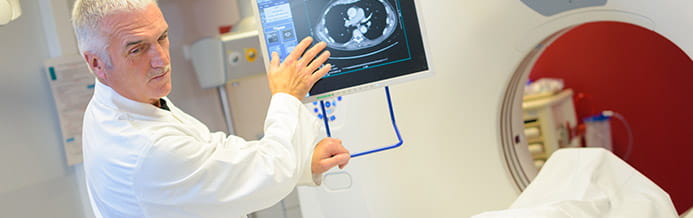 Doctor looking at prostate scans
