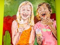 Painting by Jeremy Davis of two young girls giggling, holding ice cream