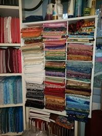 Shelves of folded quilts