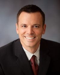 Professional headshot photo of Damon Warhus