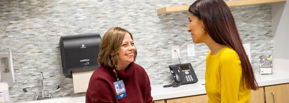 patient and provider in an exam room