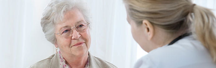 Melanoma expert discusses treatment options with patient