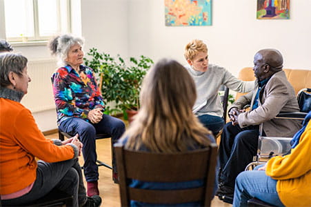 Support group discussing pain relief tactics