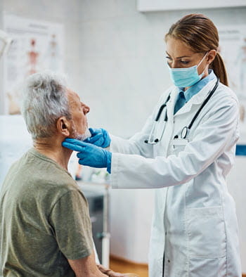 Primary Care doctor examines senior patient
