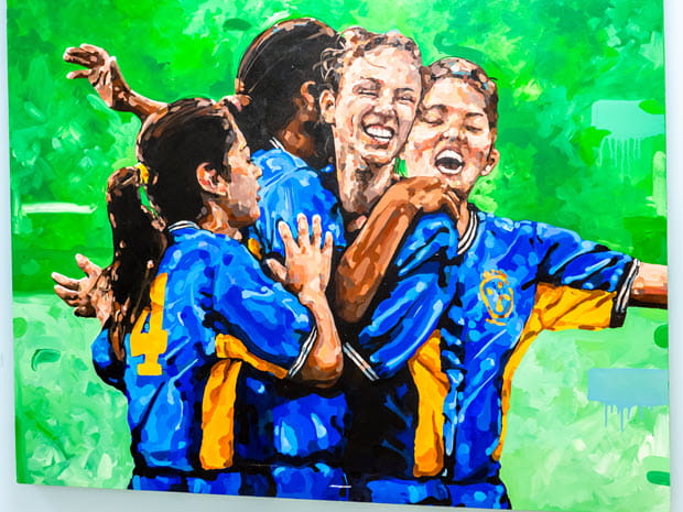 Painting by Jeremy Davis of youth celebrating, wearing soccer uniforms