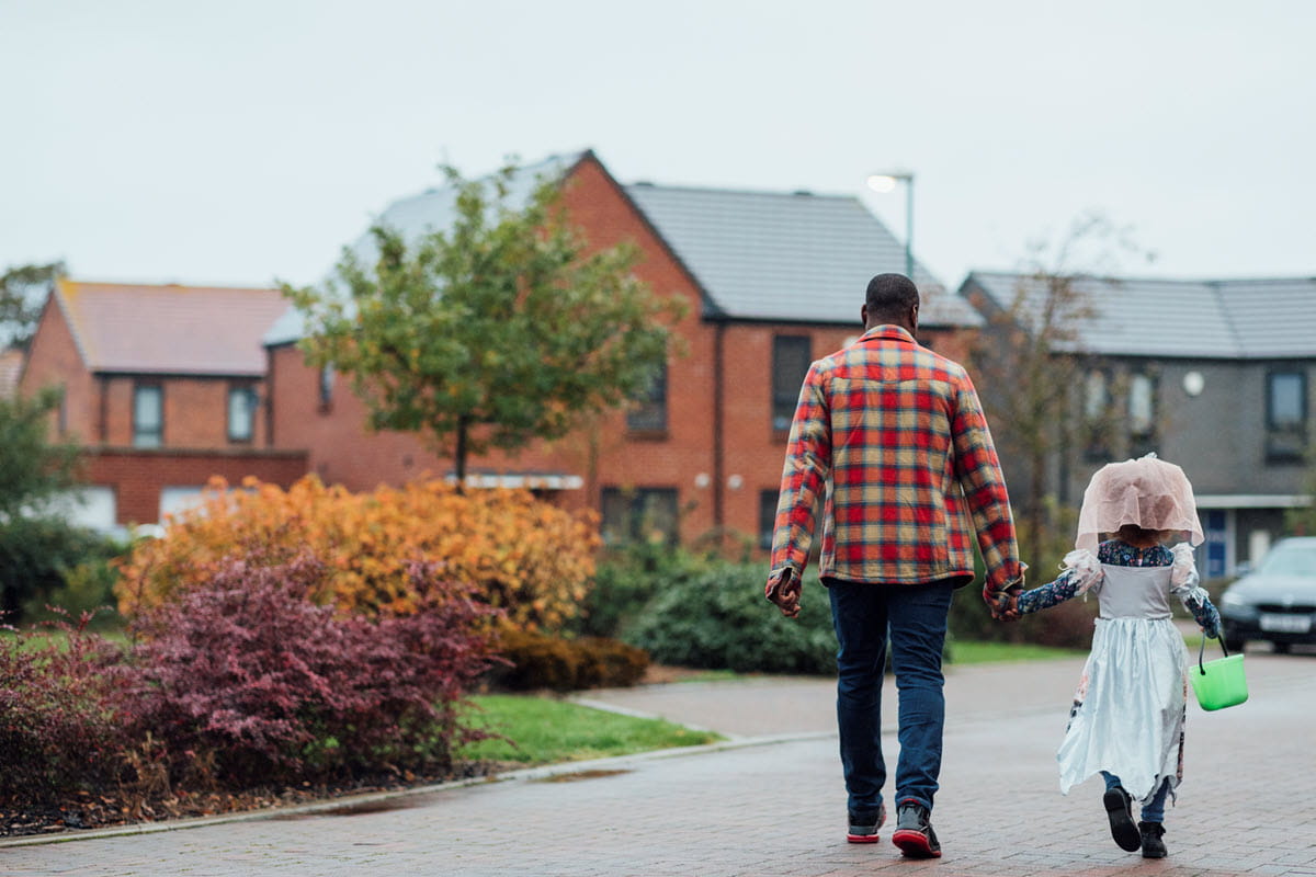 stock image of father and child on Halloween